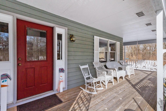 entrance to property featuring covered porch