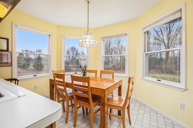 dining room with baseboards