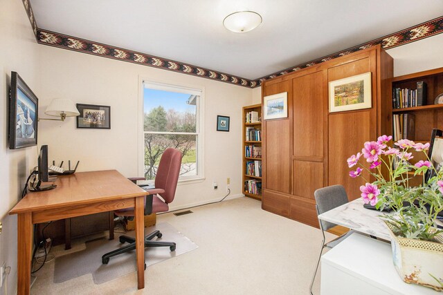 carpeted home office featuring visible vents