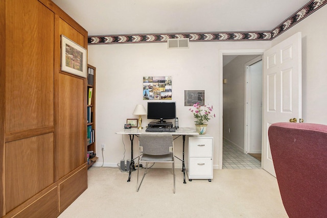 home office with light colored carpet, baseboards, and visible vents