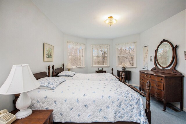 bedroom with carpet flooring and baseboards