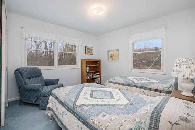 bedroom featuring carpet flooring and baseboards