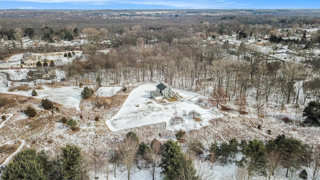 snowy aerial view with a view of trees