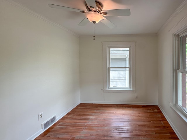 524 E Farnum Ave, Royal Oak, MI 48067 - spare room with baseboards, a wealth of natural light, wood finished floors, and visible vents