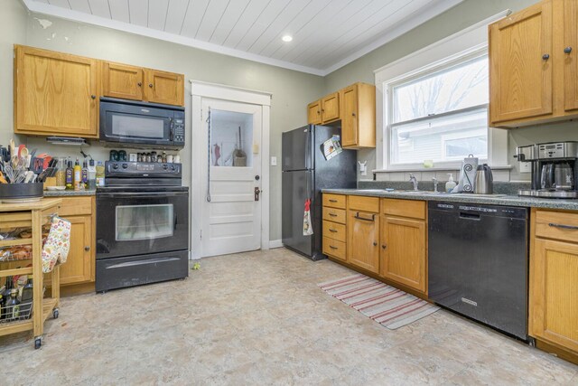 815 Wolcott Ave, Saint Joseph, MI 49085 - kitchen featuring black appliances, crown molding, dark countertops, light flooring, and a sink