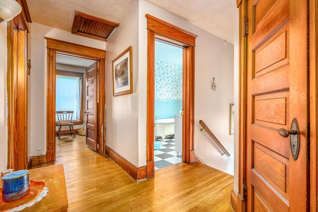 815 Wolcott Ave, Saint Joseph, MI 49085 - hallway featuring an upstairs landing, light wood-type flooring, and baseboards