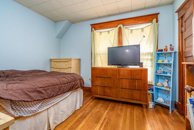 815 Wolcott Ave, Saint Joseph, MI 49085 - bedroom with hardwood / wood-style flooring and ornamental molding
