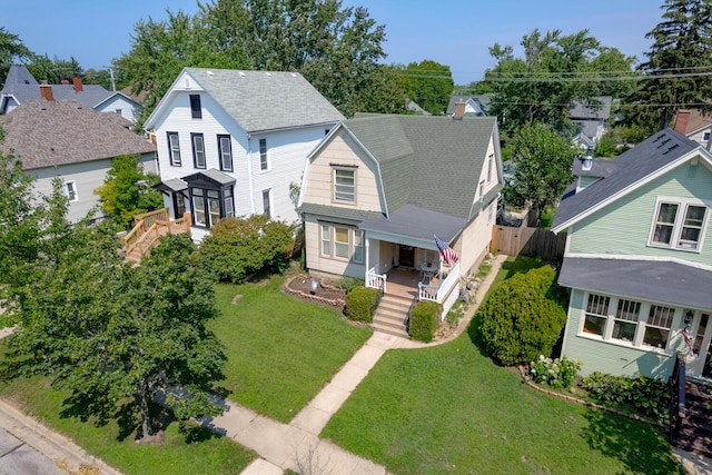 815 Wolcott Ave, Saint Joseph, MI 49085 - view of front facade with a porch, roof with shingles, a gambrel roof, and a residential view