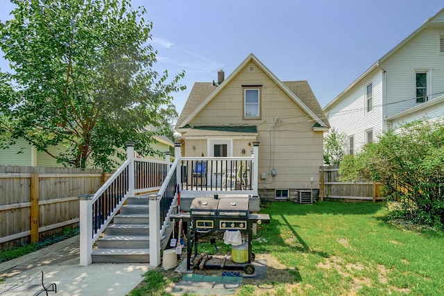 815 Wolcott Ave, Saint Joseph, MI 49085 - rear view of property with a deck and a shingled roof