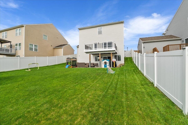 5922 Sable Ridge Dr SE, Kentwood, MI 49508 - rear view of property with a wooden deck