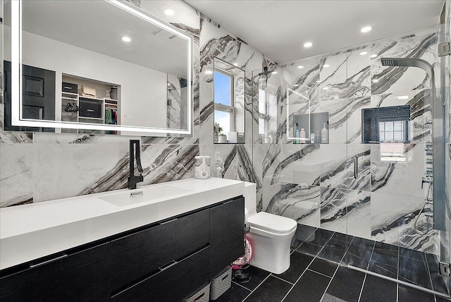 5922 Sable Ridge Dr SE, Kentwood, MI 49508 - bathroom with tile walls, a marble finish shower, toilet, vanity, and recessed lighting