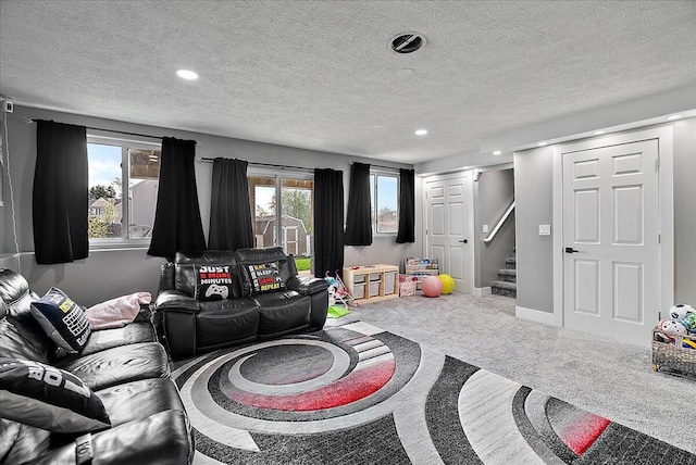 5922 Sable Ridge Dr SE, Kentwood, MI 49508 - living area with carpet floors, stairs, a textured ceiling, recessed lighting, and baseboards