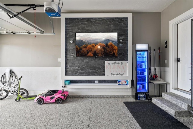 5922 Sable Ridge Dr SE, Kentwood, MI 49508 - garage view of a garage door opener and speckle patterned floor