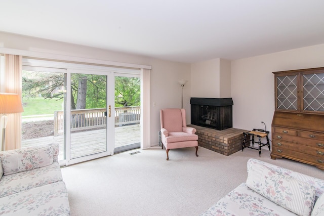 2033 Pauline Ct, Ann Arbor, MI 48103 - carpeted living room featuring visible vents and a fireplace