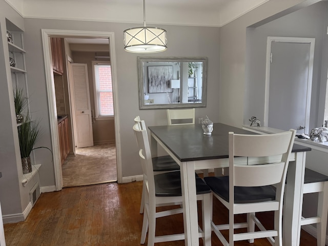 9705 Wormer Ave, Redford, MI 48239 - dining area featuring baseboards and dark wood-style floors