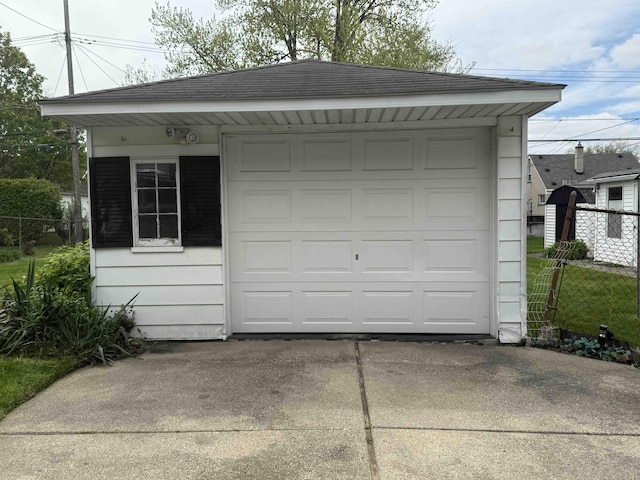 9705 Wormer Ave, Redford, MI 48239 - garage featuring fence and concrete driveway