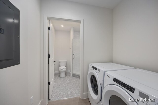 144 Oakes St SW Unit 1905, Grand Rapids, MI 49503 - laundry room featuring washer and dryer, baseboards, laundry area, and electric panel