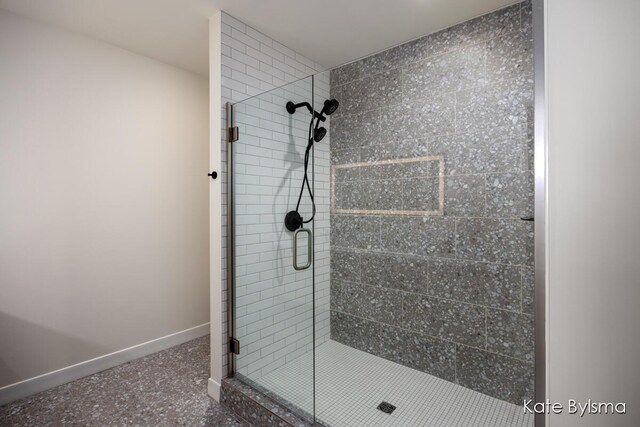 144 Oakes St SW Unit 1905, Grand Rapids, MI 49503 - full bathroom featuring baseboards and a stall shower