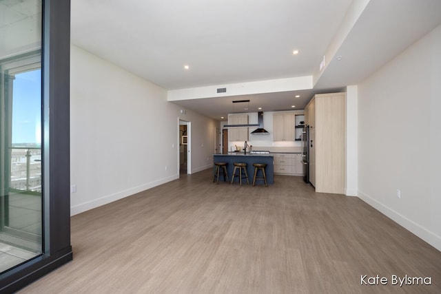 144 Oakes St SW Unit 1905, Grand Rapids, MI 49503 - unfurnished living room featuring light wood-type flooring, recessed lighting, baseboards, and visible vents