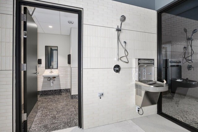 144 Oakes St SW Unit 1905, Grand Rapids, MI 49503 - full bath with recessed lighting, tile patterned flooring, a stall shower, and tile walls