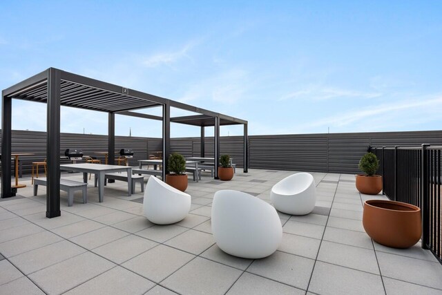 144 Oakes St SW Unit 1905, Grand Rapids, MI 49503 - view of patio with outdoor dining area and fence