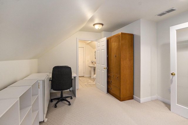 6847 Northstar Ave, Kalamazoo, MI 49009 - office area featuring vaulted ceiling, light carpet, and a sink