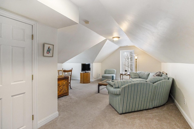 6847 Northstar Ave, Kalamazoo, MI 49009 - living area with light carpet, baseboards, and vaulted ceiling