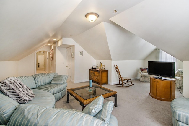 6847 Northstar Ave, Kalamazoo, MI 49009 - living room featuring light colored carpet, lofted ceiling, and baseboards