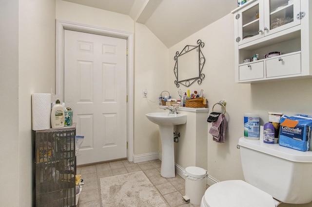 6847 Northstar Ave, Kalamazoo, MI 49009 - bathroom featuring toilet, tile patterned floors, lofted ceiling, and baseboards