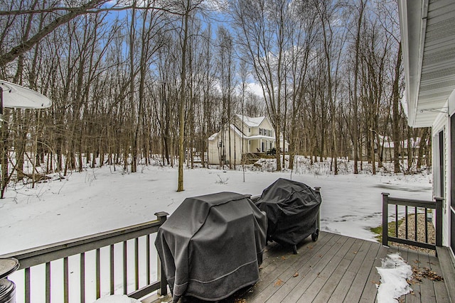 6847 Northstar Ave, Kalamazoo, MI 49009 - snow covered deck featuring grilling area and view of wooded area