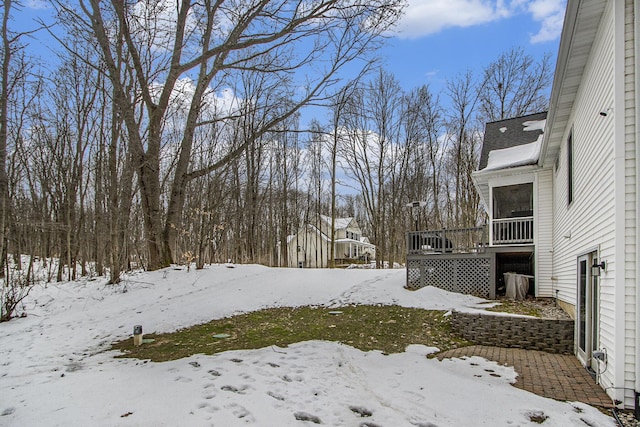 6847 Northstar Ave, Kalamazoo, MI 49009 - yard covered in snow featuring a wooden deck