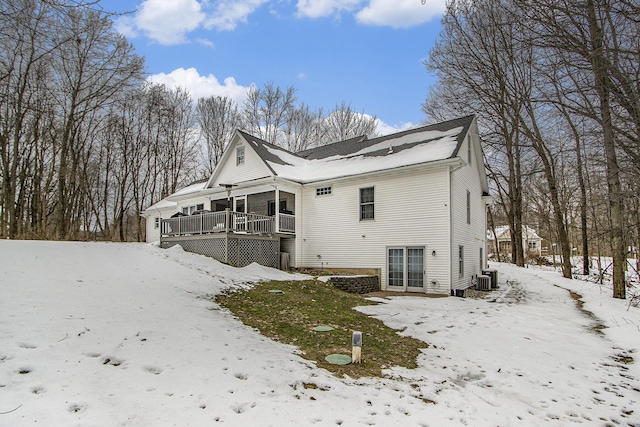6847 Northstar Ave, Kalamazoo, MI 49009 - snow covered property with a wooden deck and central AC unit