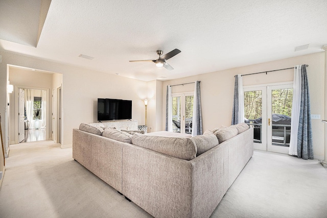 6847 Northstar Ave, Kalamazoo, MI 49009 - living room with light carpet, ceiling fan, and a textured ceiling
