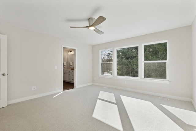 6602 E E Ave, Richland, MI 49083 - unfurnished bedroom featuring carpet floors, baseboards, ensuite bath, and ceiling fan