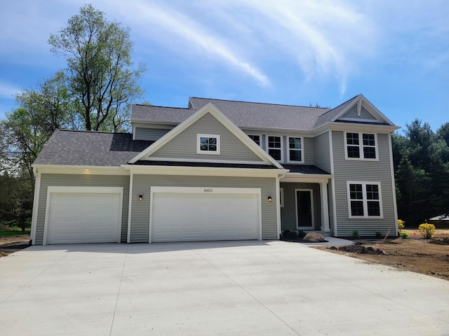 6602 E E Ave, Richland, MI 49083 - view of front facade featuring concrete driveway, a garage, and roof with shingles