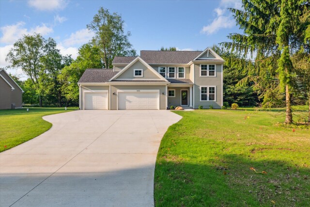 6602 E E Ave, Richland, MI 49083 - view of front of house with concrete driveway, an attached garage, a front yard, and roof with shingles