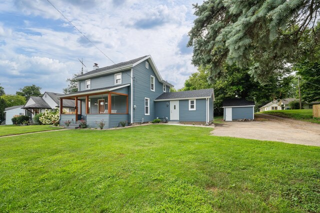 123 N 2nd St, Cassopolis, MI 49031 - back of property featuring covered porch, a storage shed, a chimney, a lawn, and an outdoor structure