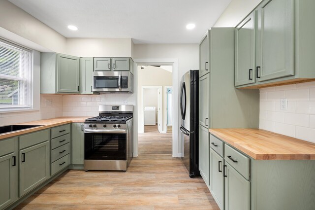123 N 2nd St, Cassopolis, MI 49031 - kitchen featuring appliances with stainless steel finishes, wooden counters, and green cabinets