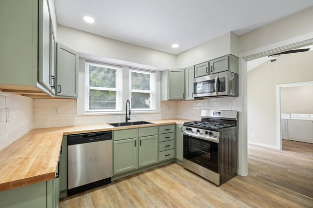 123 N 2nd St, Cassopolis, MI 49031 - kitchen featuring green cabinets, butcher block counters, appliances with stainless steel finishes, and a sink
