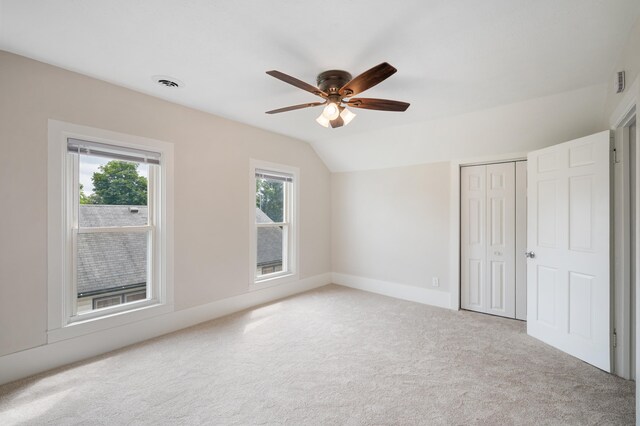 123 N 2nd St, Cassopolis, MI 49031 - unfurnished bedroom featuring multiple windows, a closet, lofted ceiling, and carpet floors