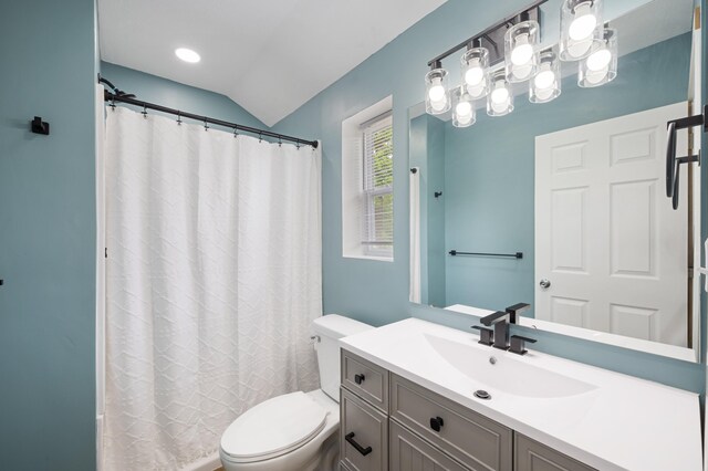 123 N 2nd St, Cassopolis, MI 49031 - bathroom featuring curtained shower, vanity, toilet, and lofted ceiling