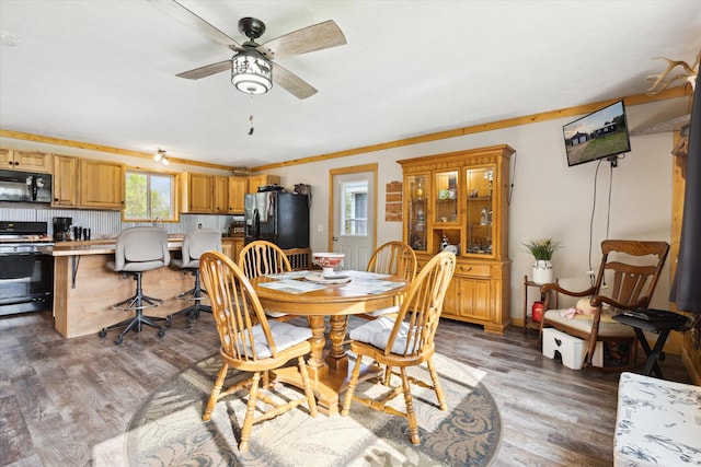 1366 Grow Rd NW, Stanton, MI 48888 - dining space with light wood-style flooring and a ceiling fan