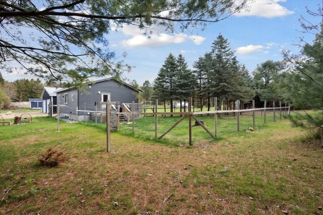 1366 Grow Rd NW, Stanton, MI 48888 - view of yard featuring a deck