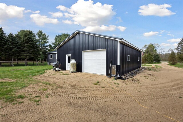 1366 Grow Rd NW, Stanton, MI 48888 - detached garage with dirt driveway