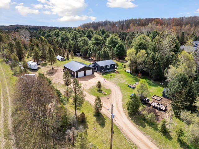 1366 Grow Rd NW, Stanton, MI 48888 - view of subject property featuring a heavily wooded area