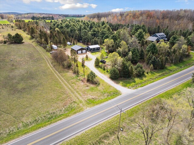 1366 Grow Rd NW, Stanton, MI 48888 - aerial view of property's location featuring a heavily wooded area