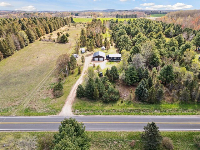 1366 Grow Rd NW, Stanton, MI 48888 - aerial view of property and surrounding area with a forest