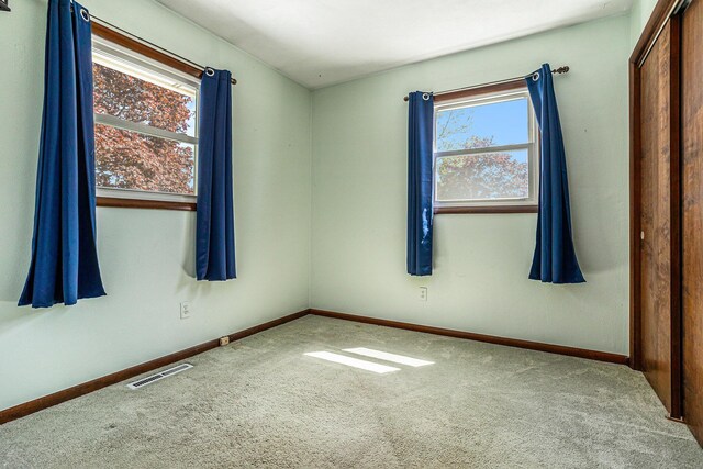 105 N Dr E, Marshall, MI 49068 - carpeted empty room with baseboards