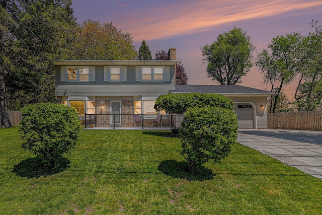 105 N Dr E, Marshall, MI 49068 - colonial house with driveway, a chimney, and an attached garage