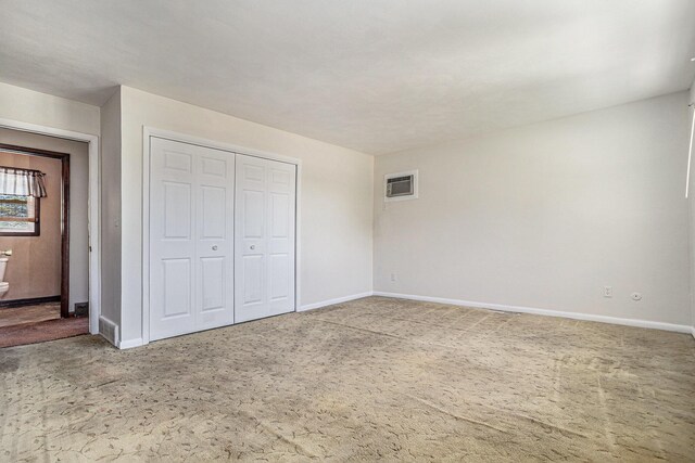 105 N Dr E, Marshall, MI 49068 - unfurnished bedroom featuring baseboards, carpet flooring, and a closet